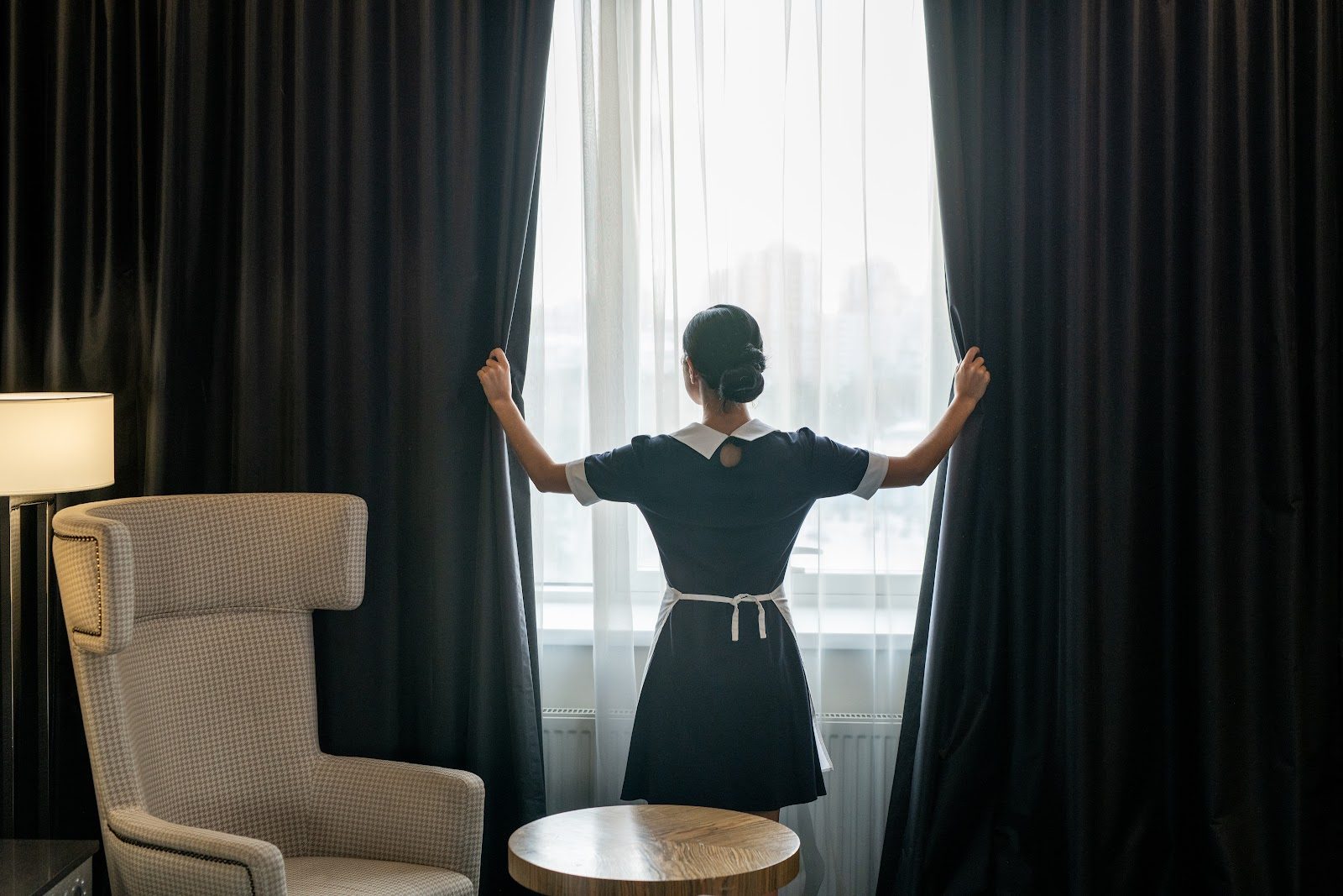 Blackout curtains being opened in a bedroom